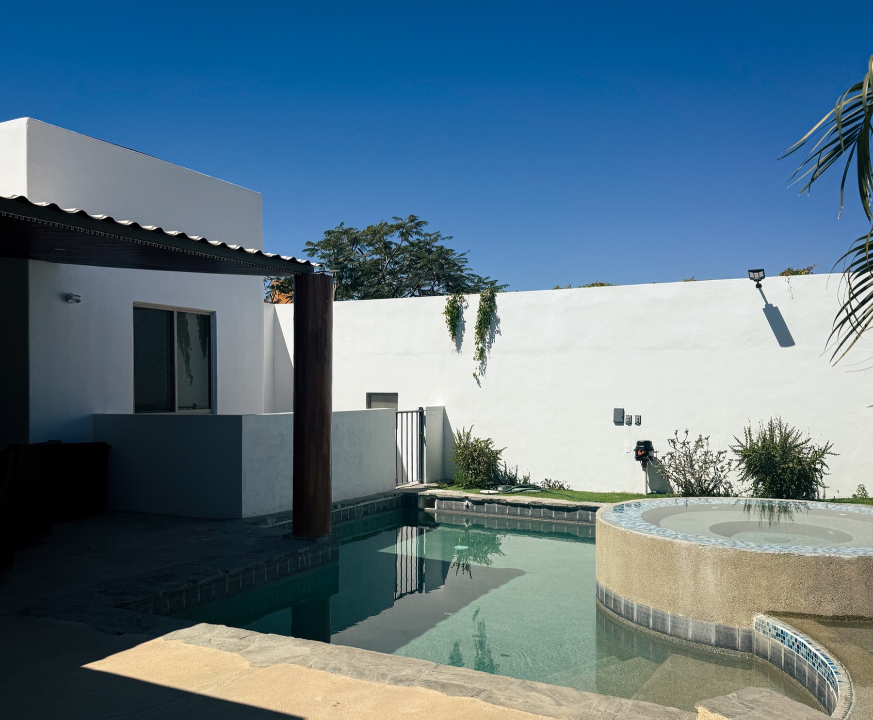 Villa exterior and pool at dusk in Cabo San Lucas