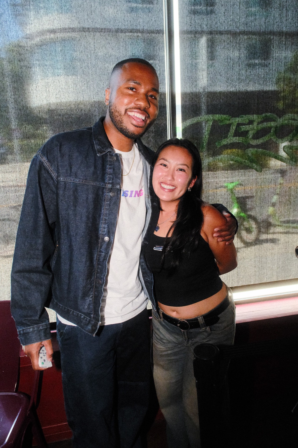 A candid portrait of two guests smiling at the premiere